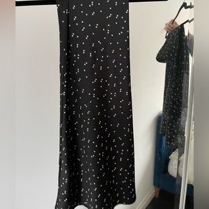 Black sateen midi skirt with stars